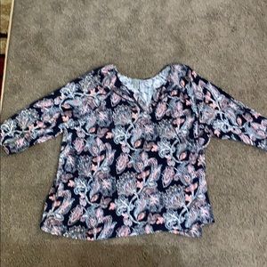 This blue blouse with flowers filling the blouse